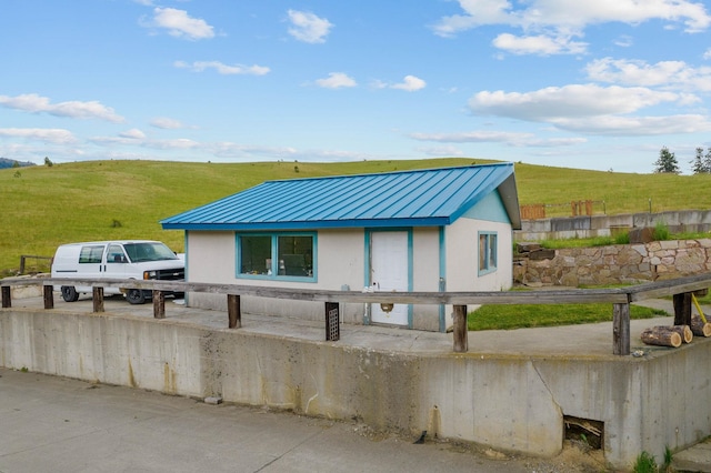 view of front of property with a rural view