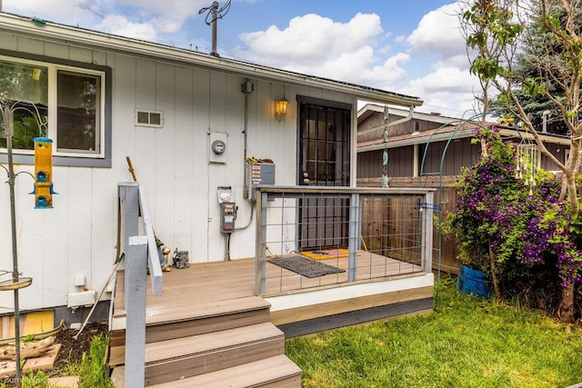 entrance to property featuring a wooden deck