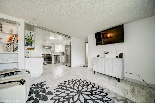 living room featuring a textured ceiling