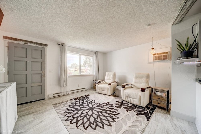 sitting room with a wall unit AC, a baseboard heating unit, light hardwood / wood-style floors, and a textured ceiling