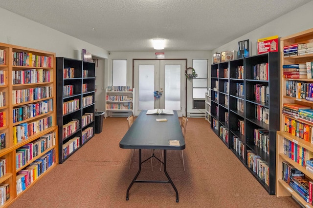 office space featuring french doors, a textured ceiling, and carpet flooring