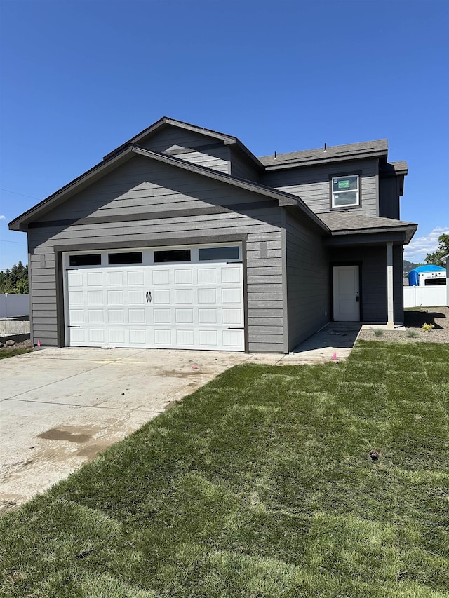18513 E Michielli Ln, Spokane Valley, WA 99016 - view of front of home with a front lawn, driveway, and a garage
