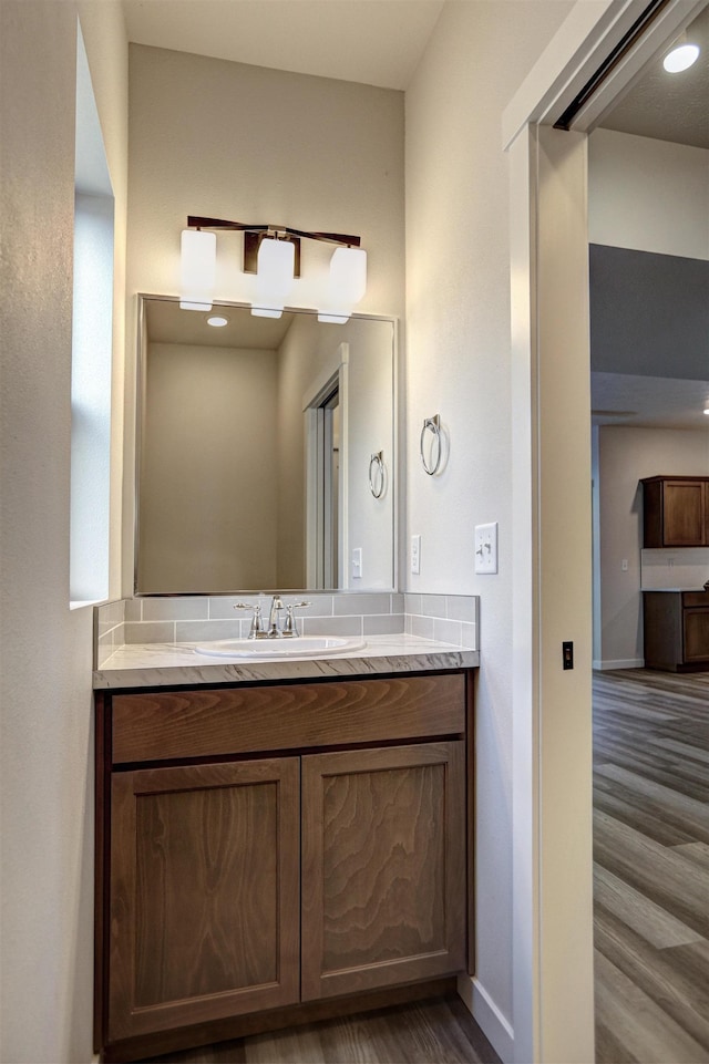 bathroom with vanity and hardwood / wood-style flooring