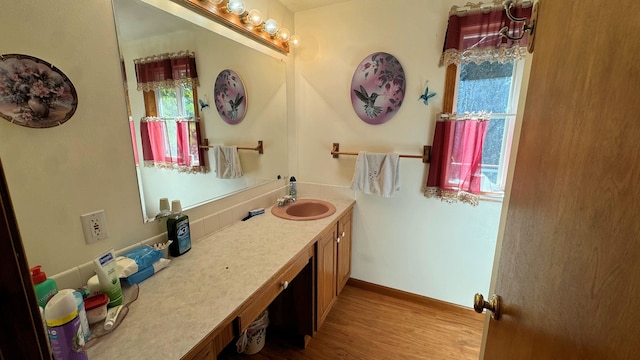 bathroom featuring wood-type flooring and vanity