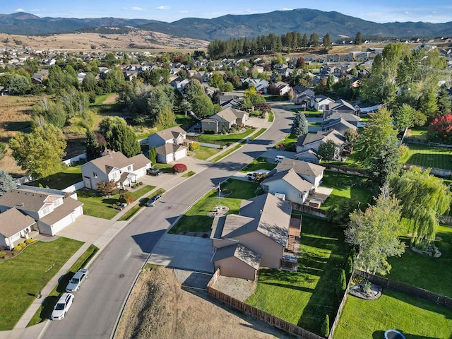 birds eye view of property with a mountain view