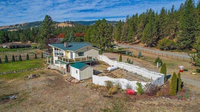 birds eye view of property with a rural view