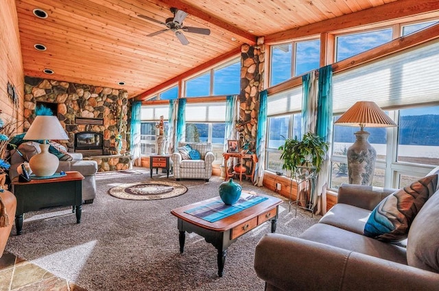 living room featuring wooden ceiling, a fireplace, ceiling fan, and beam ceiling