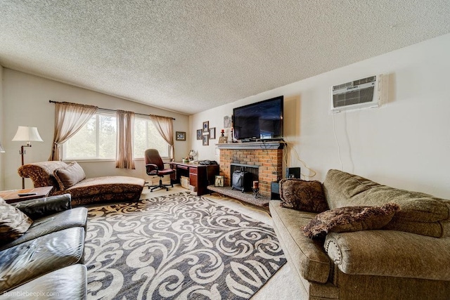 living room with an AC wall unit, a brick fireplace, a textured ceiling, and carpet flooring