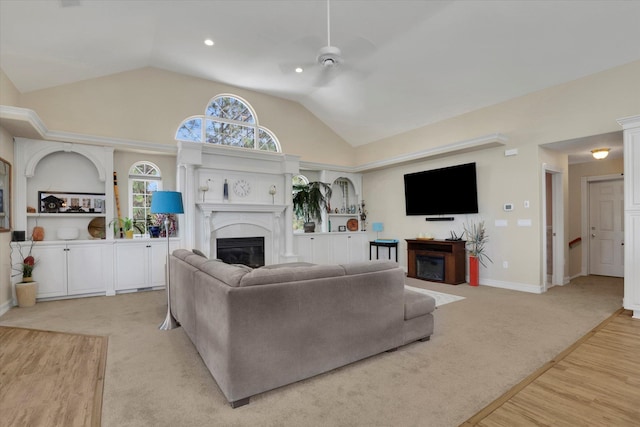 carpeted living room with lofted ceiling