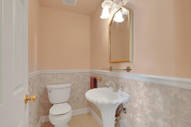 bathroom featuring toilet