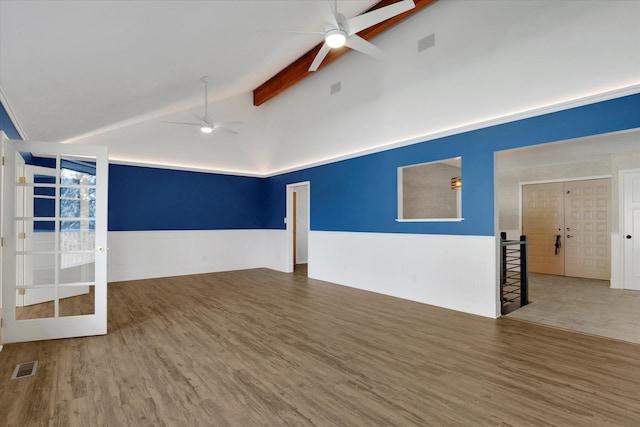 spare room with beam ceiling, hardwood / wood-style floors, ceiling fan, and high vaulted ceiling