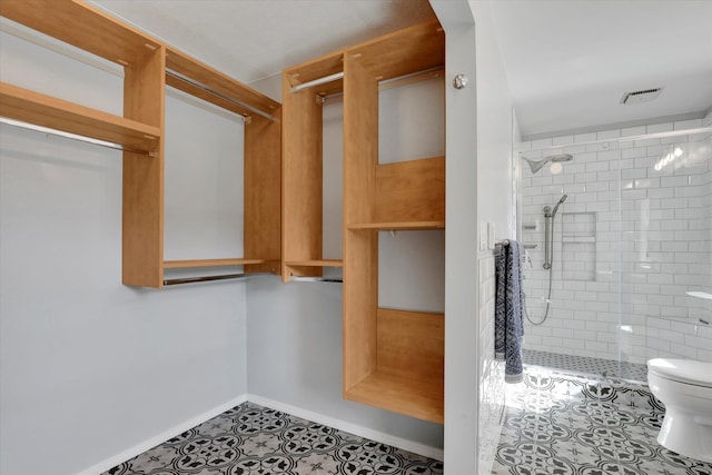 walk in closet featuring tile patterned floors