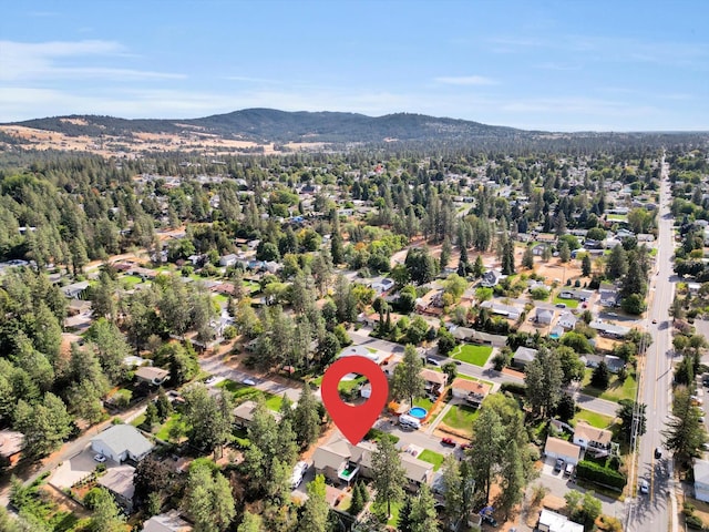 birds eye view of property featuring a mountain view