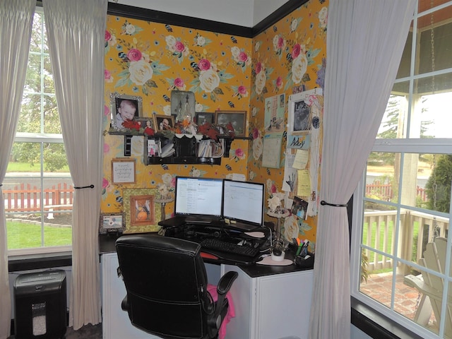 home office featuring plenty of natural light and crown molding