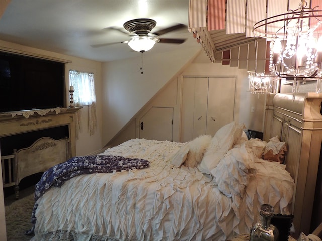 bedroom featuring ceiling fan and a closet