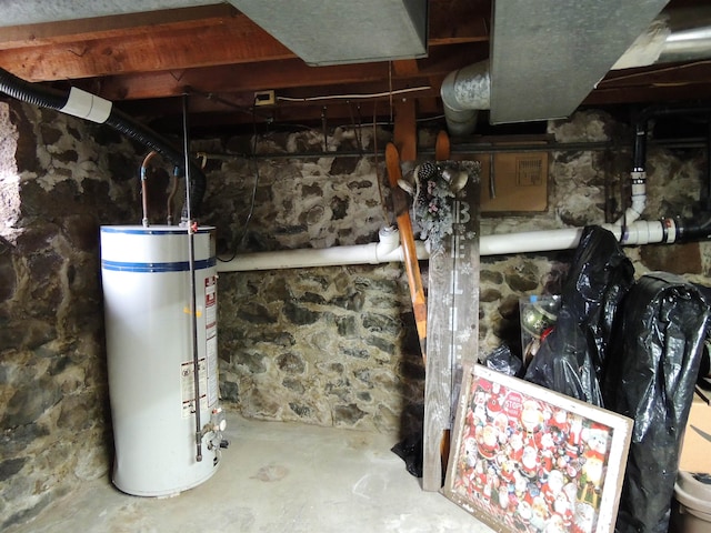 utility room featuring water heater