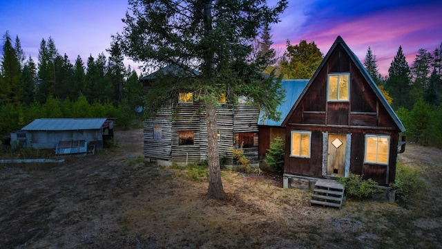 view of front of house with an outbuilding