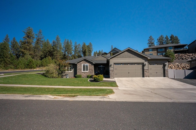 view of front facade with a garage and a front lawn