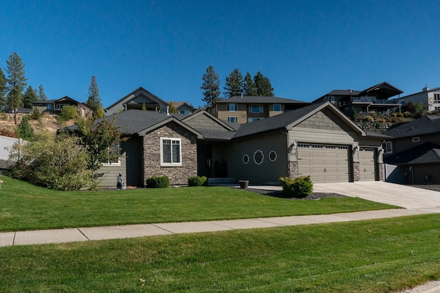 craftsman house featuring a front yard and a garage