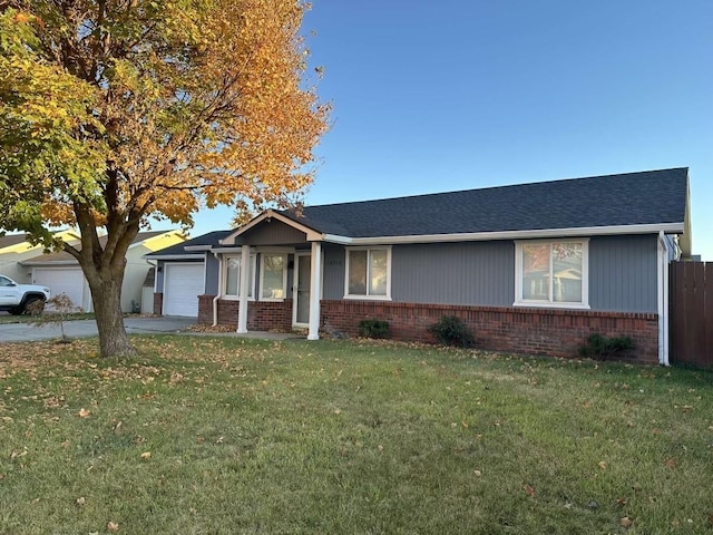 single story home featuring a front yard and a garage