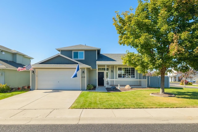 view of front of house featuring a front lawn, covered porch, and a garage