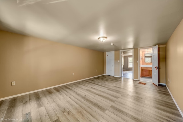 unfurnished living room with light wood-type flooring