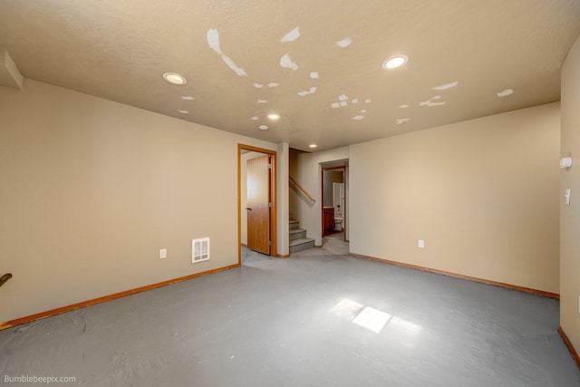 empty room featuring a textured ceiling