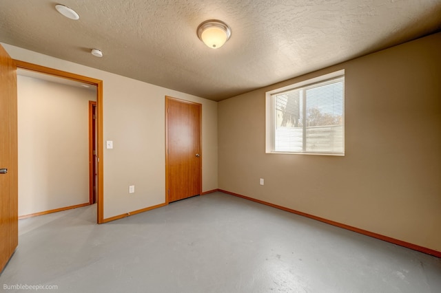 unfurnished bedroom with a closet and a textured ceiling