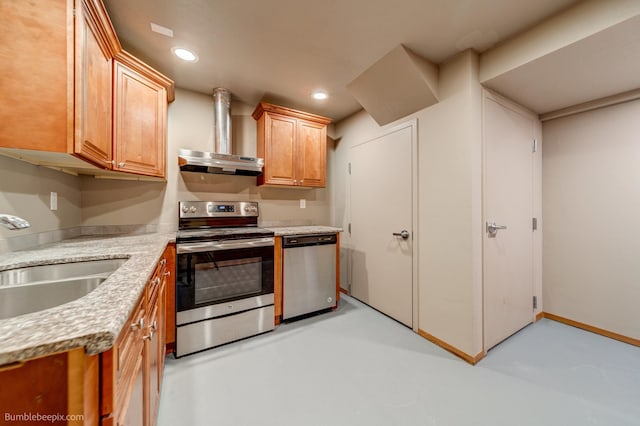 kitchen featuring light stone counters, exhaust hood, appliances with stainless steel finishes, and sink