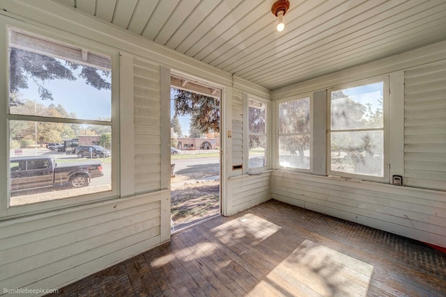 unfurnished sunroom featuring wood ceiling