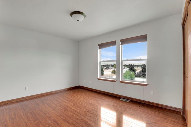 spare room with light wood-type flooring