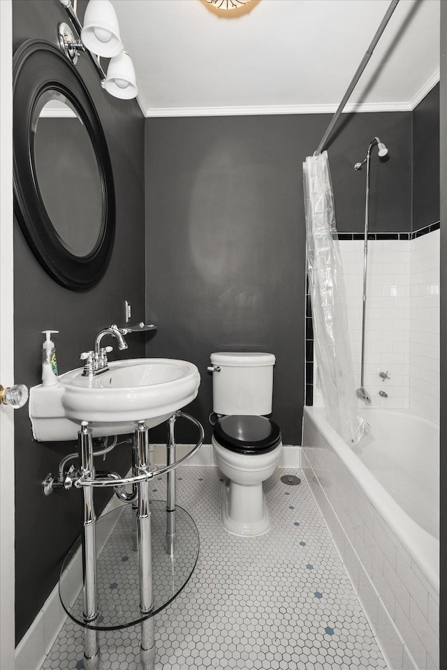 full bathroom with ornamental molding, shower / bath combo with shower curtain, toilet, and tile patterned floors