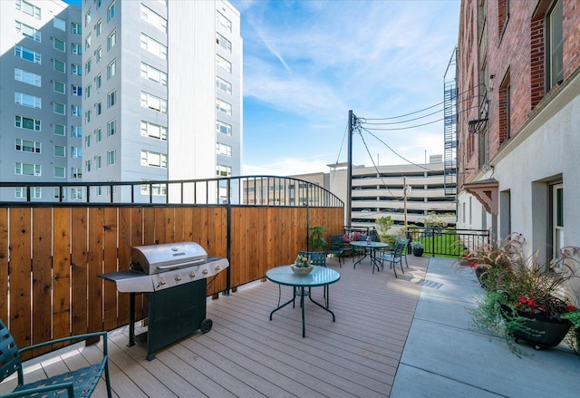 wooden terrace featuring grilling area