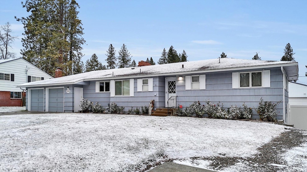 ranch-style home featuring a garage