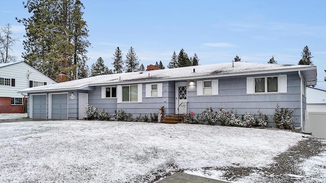 ranch-style home featuring a garage