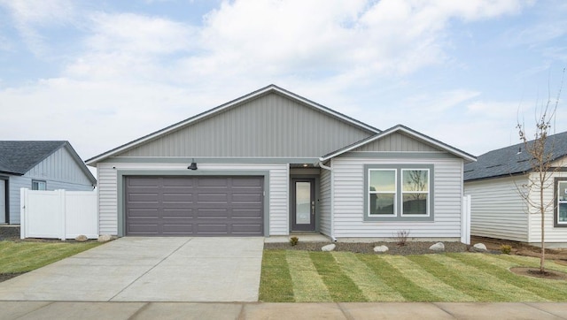 view of front facade with a front yard and a garage