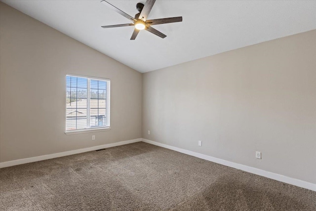 carpeted empty room featuring lofted ceiling and ceiling fan