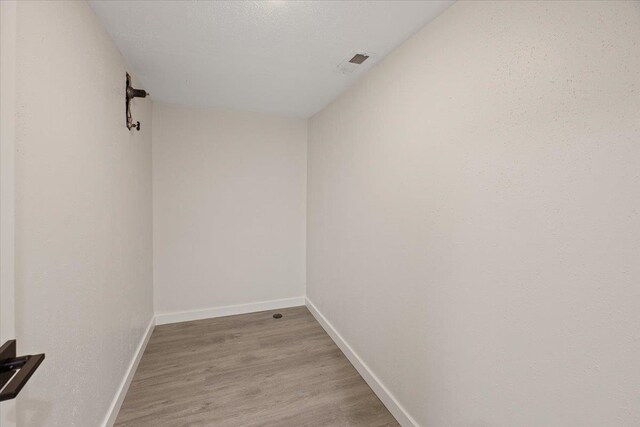 unfurnished room with light wood-type flooring