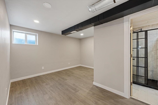 basement with wood-type flooring