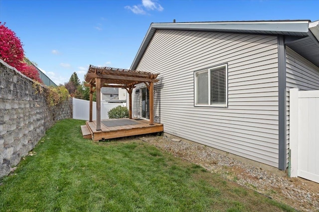 view of side of home with a pergola, a lawn, and a wooden deck