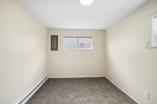 unfurnished bedroom with light carpet and a baseboard radiator