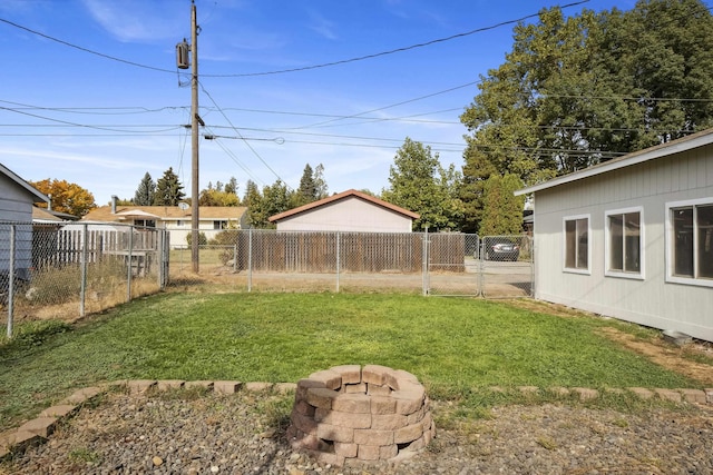 view of yard featuring a fire pit