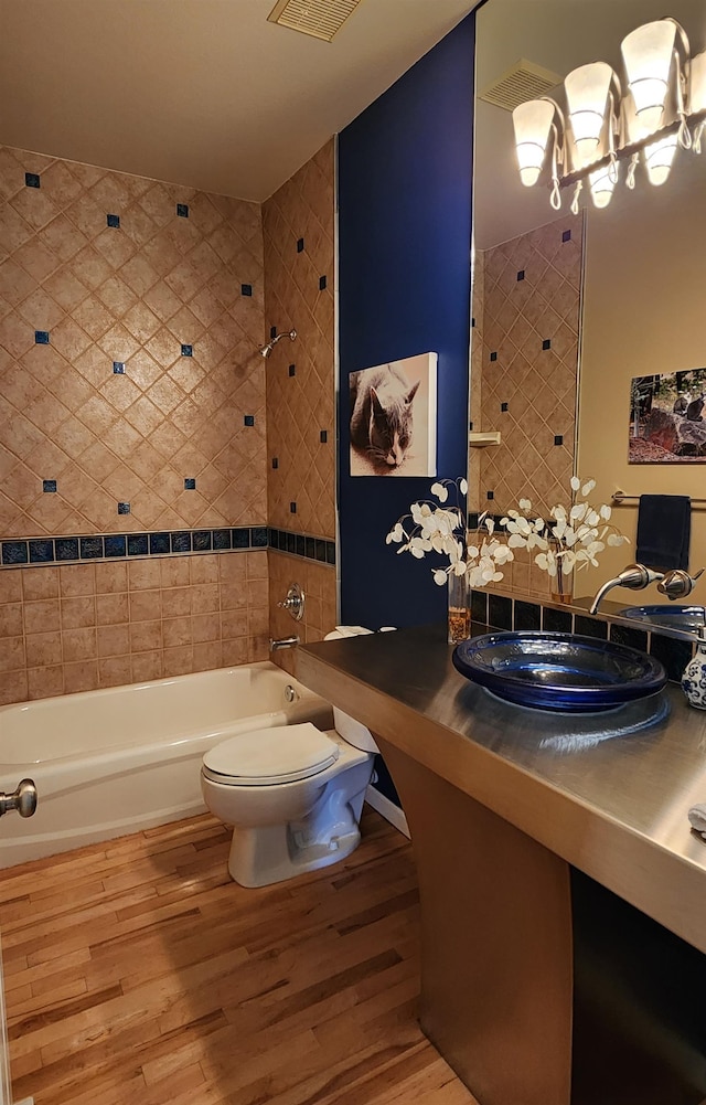 bathroom featuring sink, hardwood / wood-style flooring, and toilet