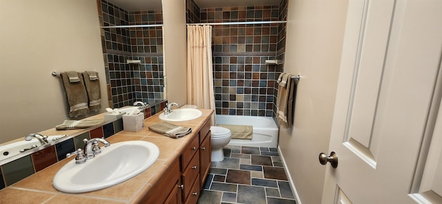 full bathroom featuring vanity, shower / tub combo, and toilet