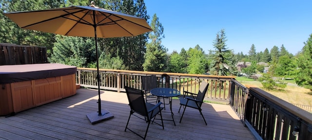 wooden deck featuring a hot tub