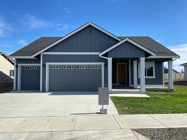 view of front of property featuring a garage and a porch