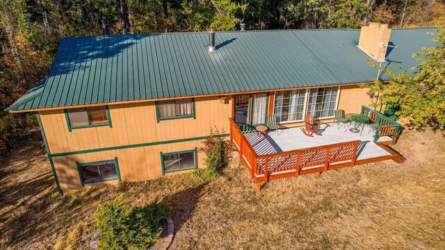 rear view of house with a patio and metal roof