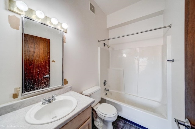 full bathroom with  shower combination, vanity, hardwood / wood-style flooring, and toilet