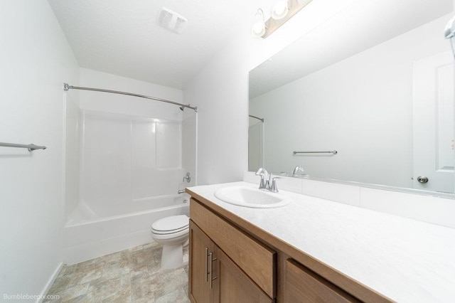 full bathroom featuring vanity, shower / washtub combination, and toilet