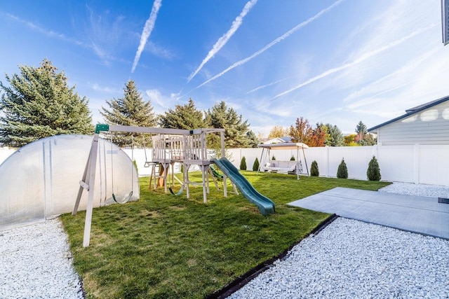 view of jungle gym featuring a lawn